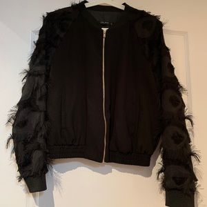 Black bomber with fringe sleeves